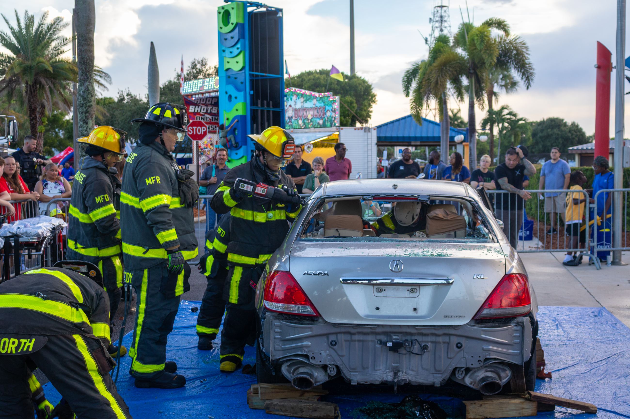 Margate Fire Department performs a vehicle extraction demonstration with residents looking on