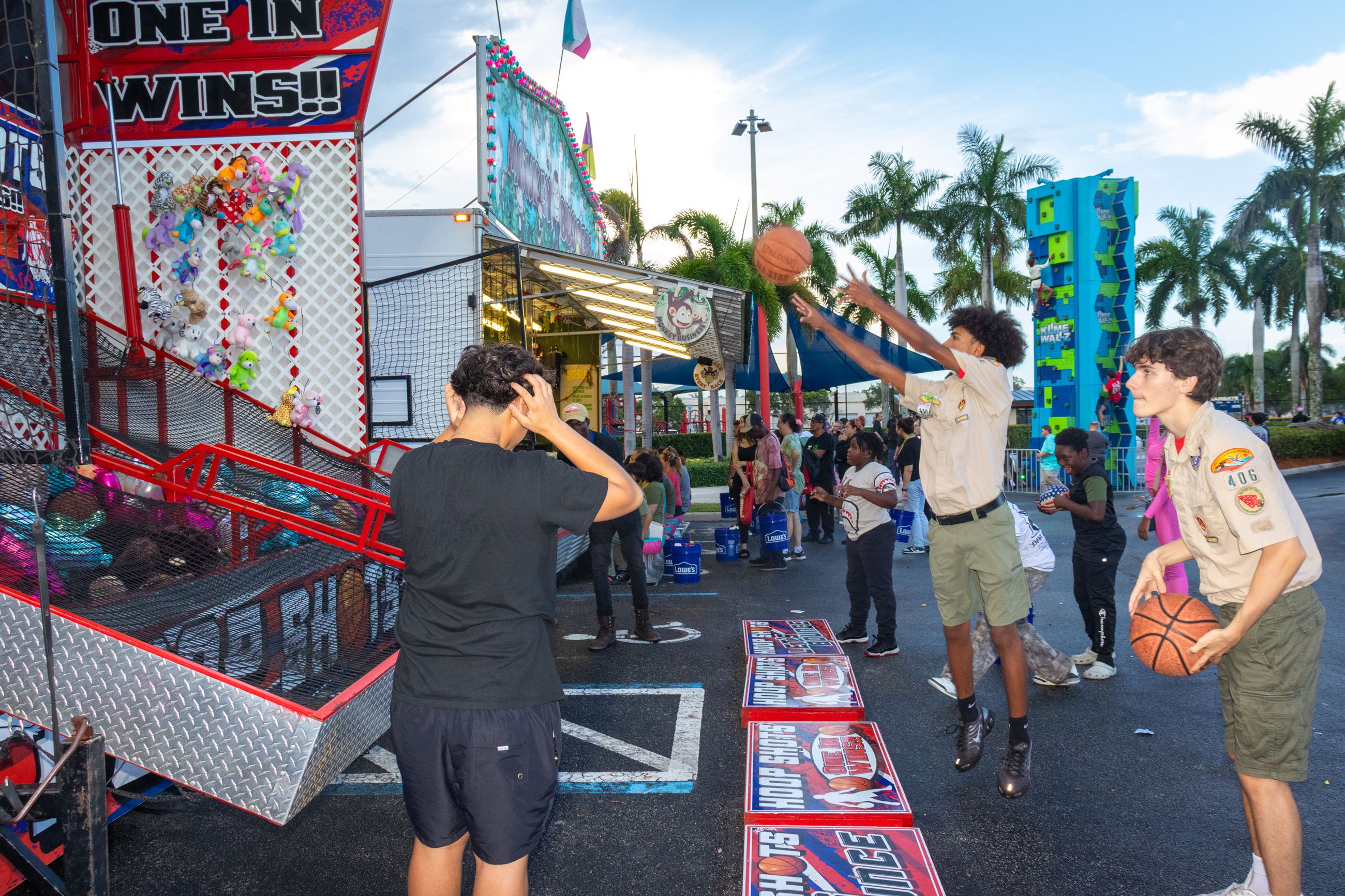 Two young attendees play basketball